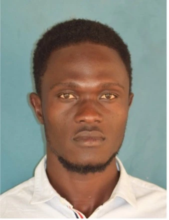 A student smiling after graduating from ECU